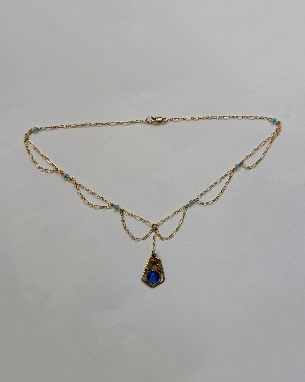 blue curtain necklace